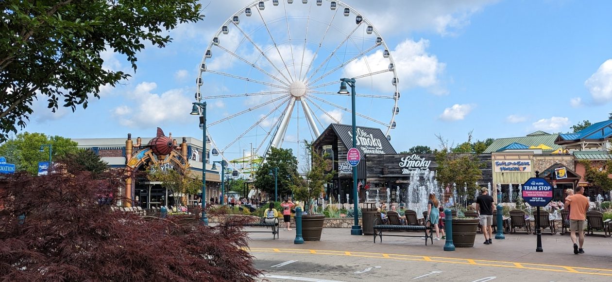 The Island entertainment complex in Pigeon Forge with the Great Smoky Mountain Wheel, shops, & outdoor seating